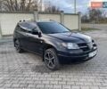 Чорний Міцубісі Аутлендер, об'ємом двигуна 2.38 л та пробігом 294 тис. км за 4550 $, фото 12 на Automoto.ua