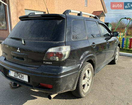 Чорний Міцубісі Аутлендер, об'ємом двигуна 2 л та пробігом 333 тис. км за 6200 $, фото 3 на Automoto.ua