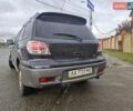 Черный Мицубиси Аутлендер, объемом двигателя 2.38 л и пробегом 340 тыс. км за 4650 $, фото 7 на Automoto.ua