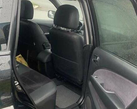 Черный Мицубиси Аутлендер, объемом двигателя 2 л и пробегом 300 тыс. км за 6500 $, фото 12 на Automoto.ua