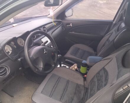 Черный Мицубиси Аутлендер, объемом двигателя 2.4 л и пробегом 3 тыс. км за 5500 $, фото 3 на Automoto.ua