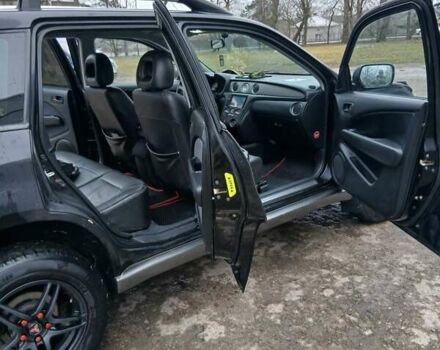 Черный Мицубиси Аутлендер, объемом двигателя 2 л и пробегом 395 тыс. км за 5200 $, фото 2 на Automoto.ua