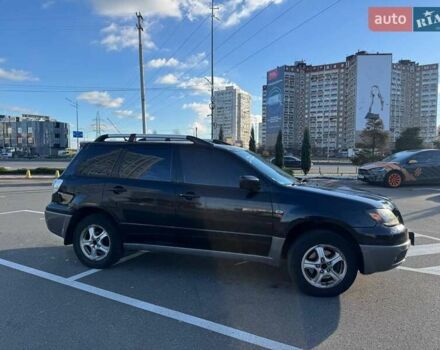 Черный Мицубиси Аутлендер, объемом двигателя 2.4 л и пробегом 351 тыс. км за 4999 $, фото 2 на Automoto.ua