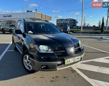 Черный Мицубиси Аутлендер, объемом двигателя 2.4 л и пробегом 351 тыс. км за 4999 $, фото 1 на Automoto.ua