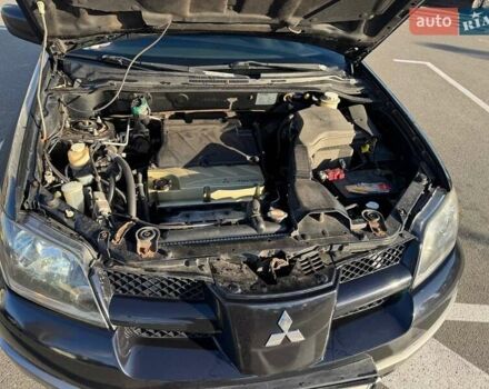 Черный Мицубиси Аутлендер, объемом двигателя 2.4 л и пробегом 351 тыс. км за 4999 $, фото 5 на Automoto.ua