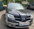 Чорний Міцубісі Аутлендер, об'ємом двигуна 2.4 л та пробігом 350 тис. км за 4500 $, фото 1 на Automoto.ua