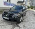 Черный Мицубиси Аутлендер, объемом двигателя 2.4 л и пробегом 300 тыс. км за 4100 $, фото 1 на Automoto.ua