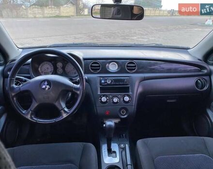 Чорний Міцубісі Аутлендер, об'ємом двигуна 2.38 л та пробігом 294 тис. км за 4550 $, фото 7 на Automoto.ua