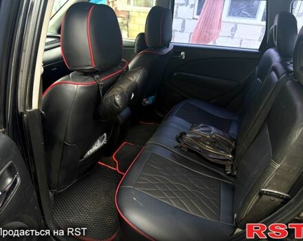 Черный Мицубиси Аутлендер, объемом двигателя 2.4 л и пробегом 357 тыс. км за 5190 $, фото 3 на Automoto.ua