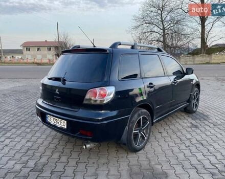 Чорний Міцубісі Аутлендер, об'ємом двигуна 2.38 л та пробігом 294 тис. км за 4550 $, фото 2 на Automoto.ua