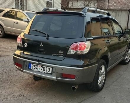 Черный Мицубиси Аутлендер, объемом двигателя 2.4 л и пробегом 243 тыс. км за 1846 $, фото 2 на Automoto.ua