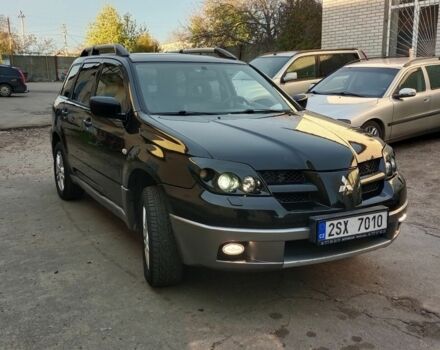 Черный Мицубиси Аутлендер, объемом двигателя 2.4 л и пробегом 243 тыс. км за 1846 $, фото 1 на Automoto.ua