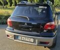 Черный Мицубиси Аутлендер, объемом двигателя 2 л и пробегом 228 тыс. км за 5800 $, фото 5 на Automoto.ua