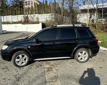 Черный Мицубиси Аутлендер, объемом двигателя 2.4 л и пробегом 307 тыс. км за 5600 $, фото 3 на Automoto.ua