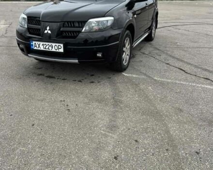 Черный Мицубиси Аутлендер, объемом двигателя 2.4 л и пробегом 190 тыс. км за 6800 $, фото 2 на Automoto.ua