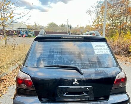 Черный Мицубиси Аутлендер, объемом двигателя 2 л и пробегом 295 тыс. км за 7500 $, фото 4 на Automoto.ua