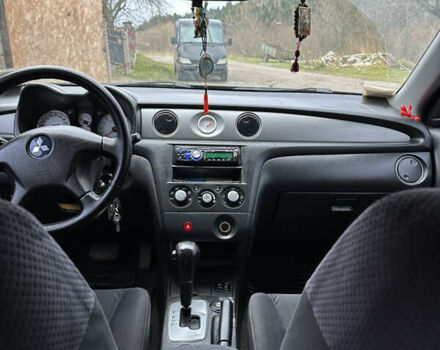 Черный Мицубиси Аутлендер, объемом двигателя 2.38 л и пробегом 160 тыс. км за 6300 $, фото 5 на Automoto.ua