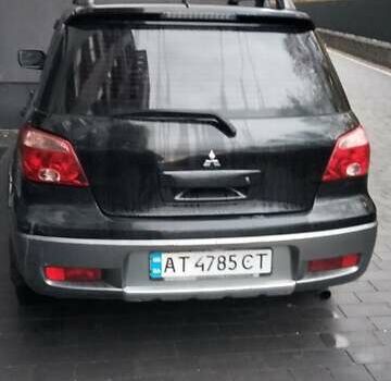 Черный Мицубиси Аутлендер, объемом двигателя 2 л и пробегом 380 тыс. км за 5000 $, фото 3 на Automoto.ua