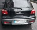 Черный Мицубиси Аутлендер, объемом двигателя 2 л и пробегом 380 тыс. км за 5000 $, фото 3 на Automoto.ua