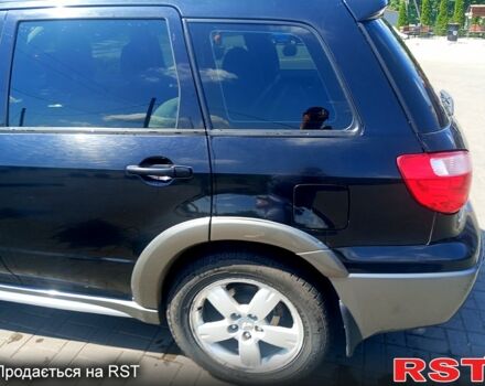 Черный Мицубиси Аутлендер, объемом двигателя 2.4 л и пробегом 270 тыс. км за 7800 $, фото 7 на Automoto.ua