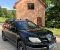Чорний Міцубісі Аутлендер, об'ємом двигуна 2 л та пробігом 200 тис. км за 7000 $, фото 1 на Automoto.ua