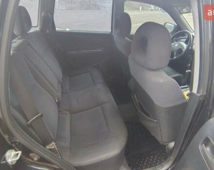 Черный Мицубиси Аутлендер, объемом двигателя 2 л и пробегом 330 тыс. км за 4997 $, фото 13 на Automoto.ua