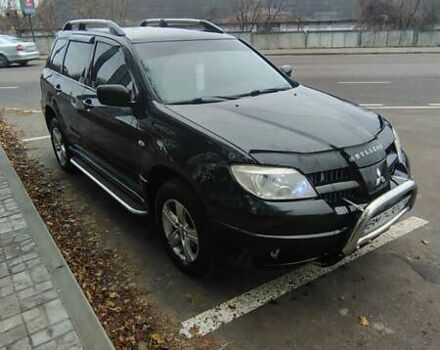 Черный Мицубиси Аутлендер, объемом двигателя 2 л и пробегом 330 тыс. км за 4997 $, фото 2 на Automoto.ua