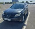 Черный Мицубиси Аутлендер, объемом двигателя 2.38 л и пробегом 380 тыс. км за 6500 $, фото 1 на Automoto.ua