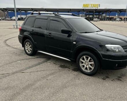 Черный Мицубиси Аутлендер, объемом двигателя 2.4 л и пробегом 190 тыс. км за 6800 $, фото 3 на Automoto.ua