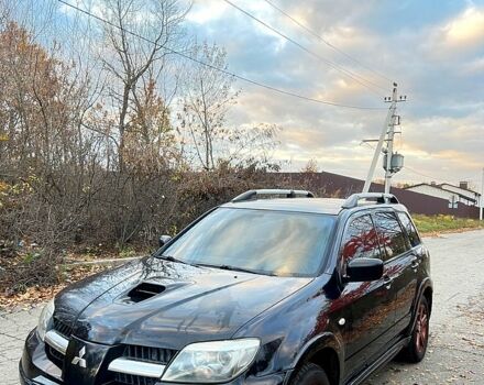 Черный Мицубиси Аутлендер, объемом двигателя 2 л и пробегом 295 тыс. км за 7500 $, фото 2 на Automoto.ua