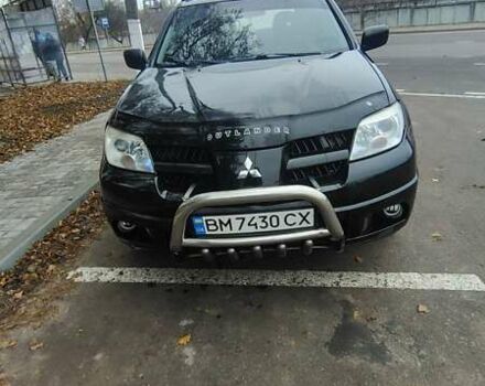 Черный Мицубиси Аутлендер, объемом двигателя 2 л и пробегом 330 тыс. км за 4997 $, фото 1 на Automoto.ua