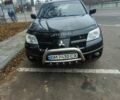 Черный Мицубиси Аутлендер, объемом двигателя 2 л и пробегом 330 тыс. км за 4997 $, фото 1 на Automoto.ua