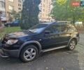 Черный Мицубиси Аутлендер, объемом двигателя 2 л и пробегом 74 тыс. км за 6300 $, фото 1 на Automoto.ua