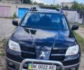 Черный Мицубиси Аутлендер, объемом двигателя 2.38 л и пробегом 148 тыс. км за 7500 $, фото 1 на Automoto.ua