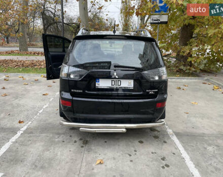 Черный Мицубиси Аутлендер, объемом двигателя 2.4 л и пробегом 300 тыс. км за 8500 $, фото 3 на Automoto.ua