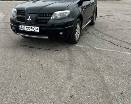 Чорний Міцубісі Аутлендер, об'ємом двигуна 2.38 л та пробігом 190 тис. км за 6800 $, фото 4 на Automoto.ua