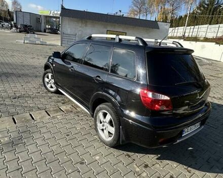 Черный Мицубиси Аутлендер, объемом двигателя 2.4 л и пробегом 307 тыс. км за 5600 $, фото 6 на Automoto.ua