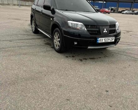 Черный Мицубиси Аутлендер, объемом двигателя 2.4 л и пробегом 190 тыс. км за 6800 $, фото 1 на Automoto.ua