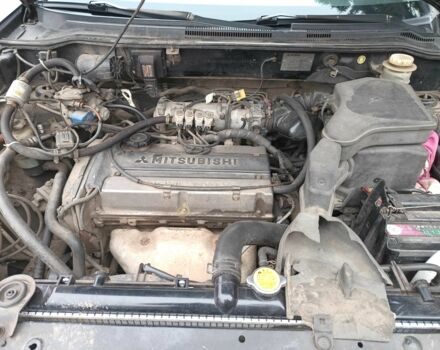 Черный Мицубиси Аутлендер, объемом двигателя 2 л и пробегом 495 тыс. км за 4400 $, фото 1 на Automoto.ua