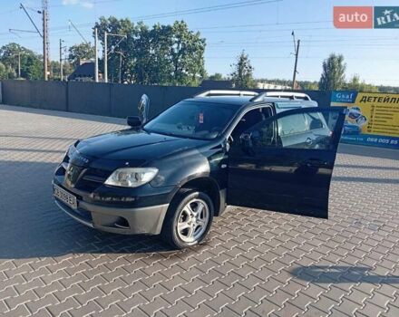 Чорний Міцубісі Аутлендер, об'ємом двигуна 2 л та пробігом 274 тис. км за 5300 $, фото 1 на Automoto.ua