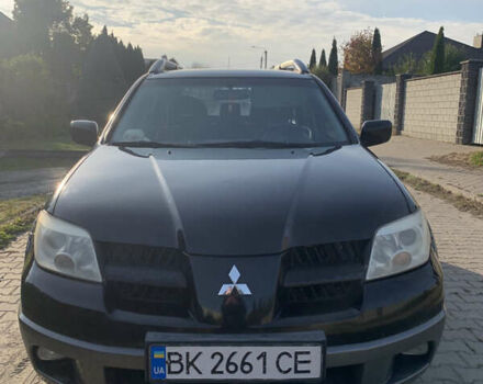 Чорний Міцубісі Аутлендер, об'ємом двигуна 2.4 л та пробігом 285 тис. км за 4300 $, фото 1 на Automoto.ua