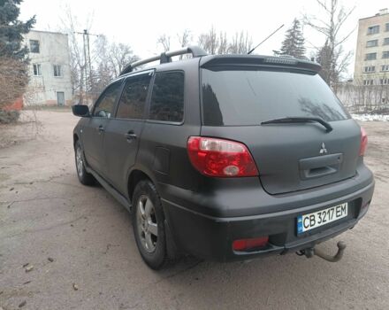 Черный Мицубиси Аутлендер, объемом двигателя 2 л и пробегом 495 тыс. км за 4400 $, фото 5 на Automoto.ua