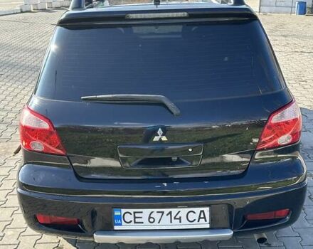 Черный Мицубиси Аутлендер, объемом двигателя 2.4 л и пробегом 307 тыс. км за 5600 $, фото 7 на Automoto.ua