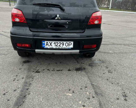 Чорний Міцубісі Аутлендер, об'ємом двигуна 2.38 л та пробігом 190 тис. км за 6800 $, фото 6 на Automoto.ua