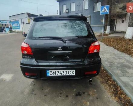 Черный Мицубиси Аутлендер, объемом двигателя 2 л и пробегом 330 тыс. км за 4997 $, фото 4 на Automoto.ua