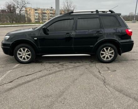Черный Мицубиси Аутлендер, объемом двигателя 2.4 л и пробегом 190 тыс. км за 6800 $, фото 4 на Automoto.ua