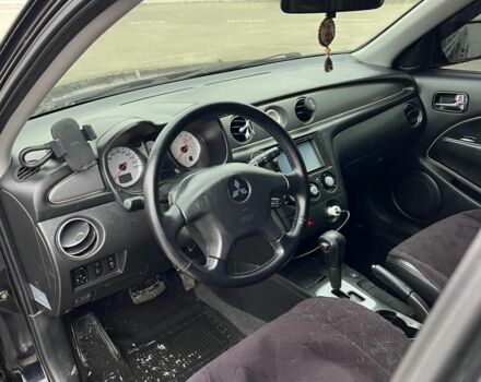 Черный Мицубиси Аутлендер, объемом двигателя 2.4 л и пробегом 190 тыс. км за 6800 $, фото 11 на Automoto.ua