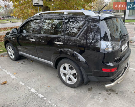 Черный Мицубиси Аутлендер, объемом двигателя 2.4 л и пробегом 300 тыс. км за 8500 $, фото 4 на Automoto.ua
