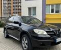 Черный Мицубиси Аутлендер, объемом двигателя 2.38 л и пробегом 270 тыс. км за 5900 $, фото 1 на Automoto.ua