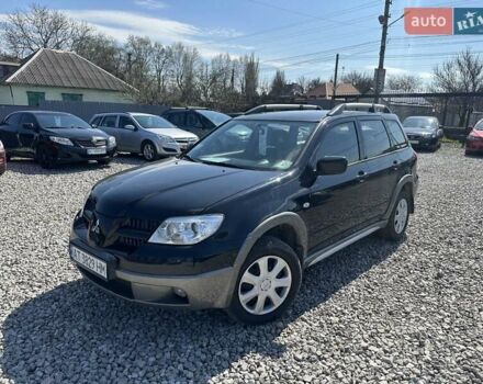 Черный Мицубиси Аутлендер, объемом двигателя 2.4 л и пробегом 204 тыс. км за 5390 $, фото 1 на Automoto.ua